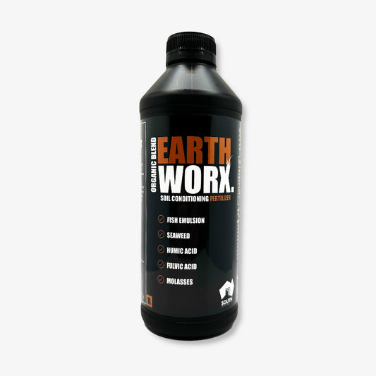 Image of Earthworx soil conditioner bottle with key ingredients highlighted: fish emulsion, seaweed, fulvic acid, humic acid, and molasses, promoting plant growth and soil health